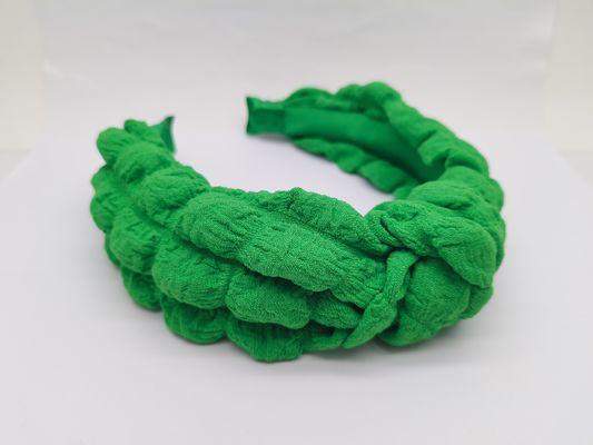 La fascia creativa verde per i capelli per l'uso quotidiano o per la performance