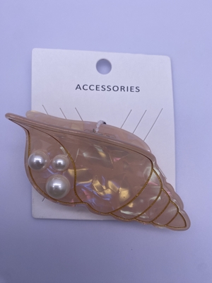 Fermaglio per capelli in acrilico con dettaglio di perla e conchiglia in design alla moda